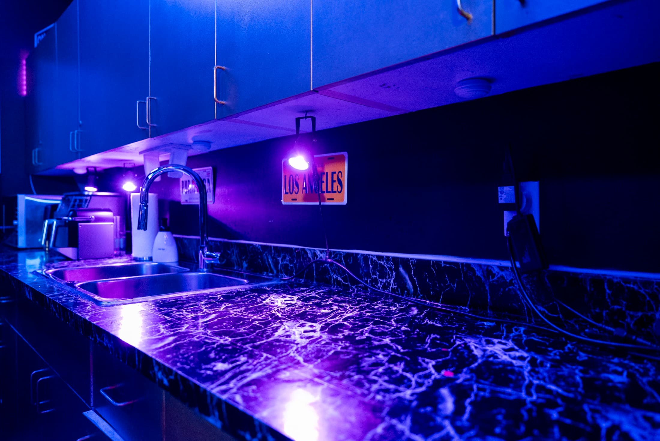 Prep kitchen at Lush Event Space — marble counter, sink and coffee station for catering and event staff